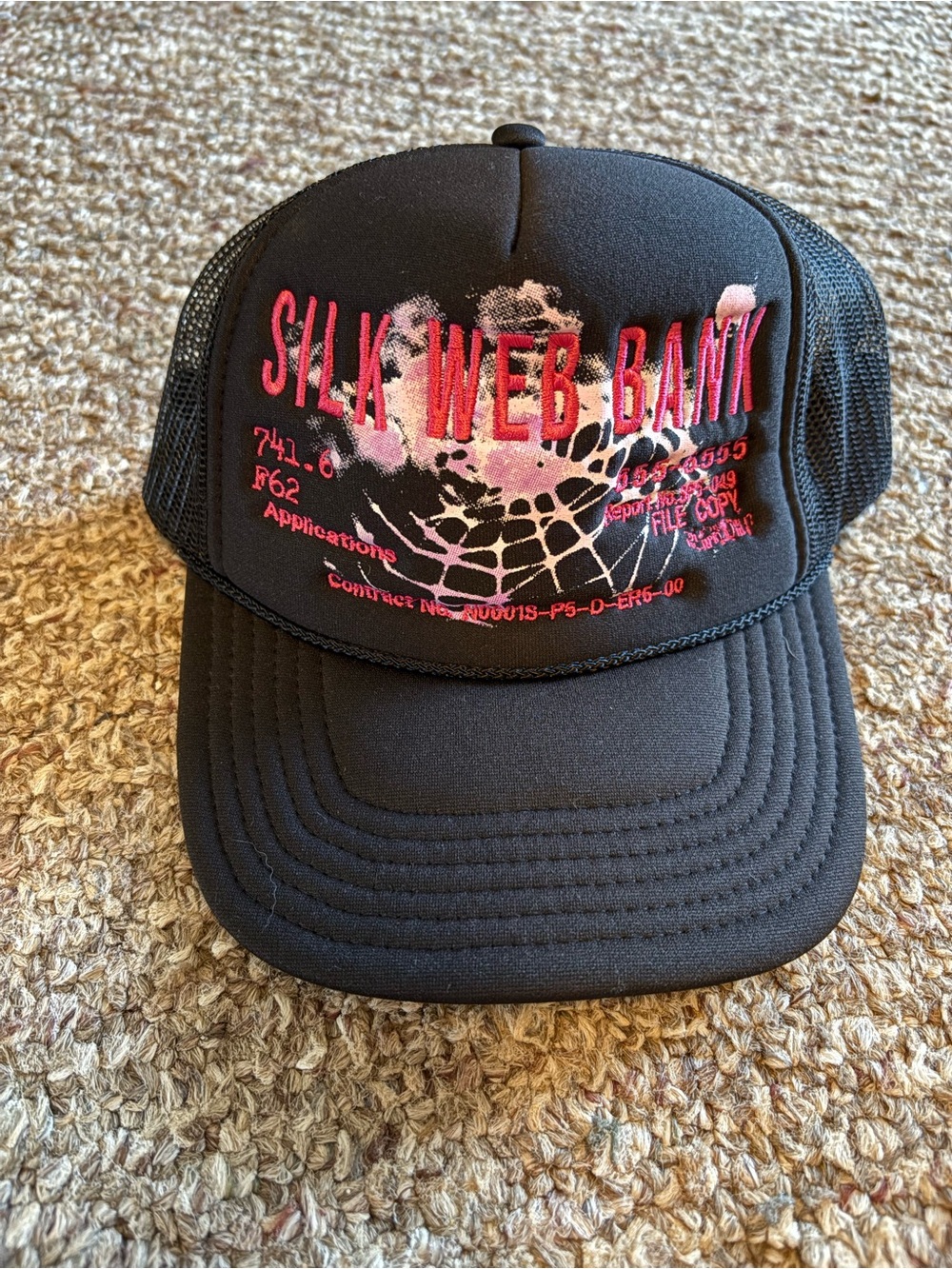 Silk Web Bank Black Trucker Hat with Pink Graphic